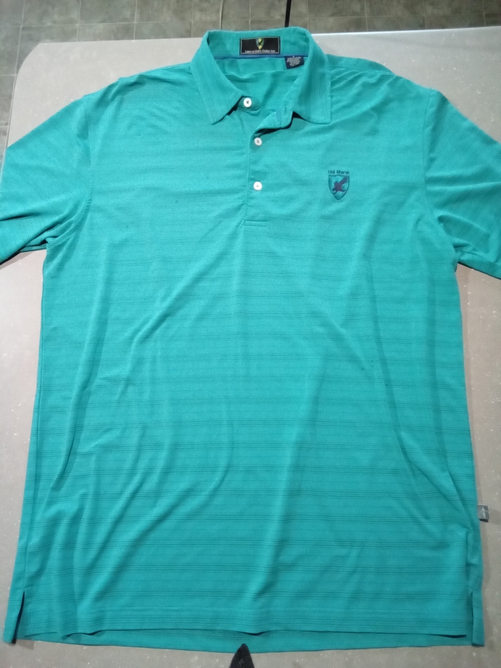 Links To Golfs Golden Age. Large. Men's Polo with Old Marsh Golf Club Crest